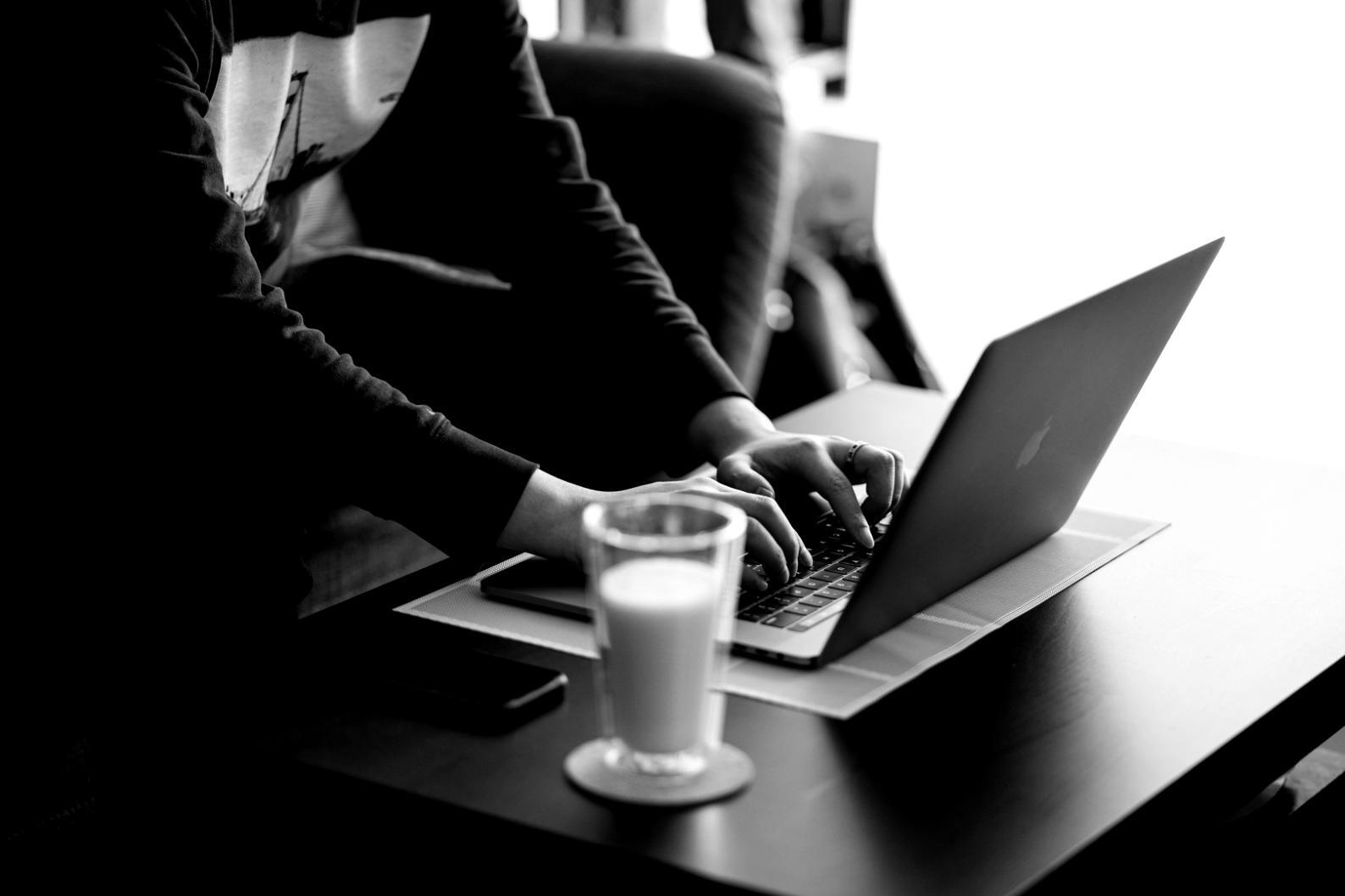 Modern budgeting setup with laptop and financial planning materials